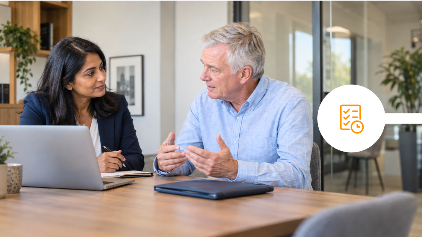 Financial adviser meeting a client at an office table