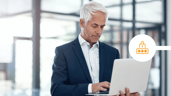 CEO looking at laptop to send secure communications
