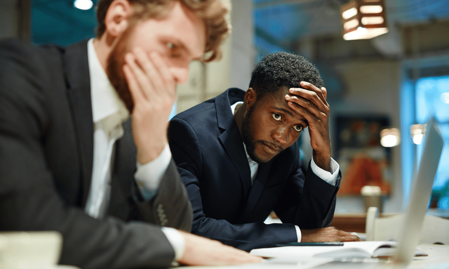 Colleagues reviewing an email mistake