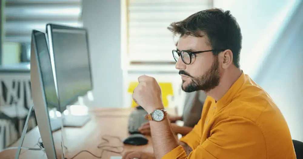 Developer on computer in office