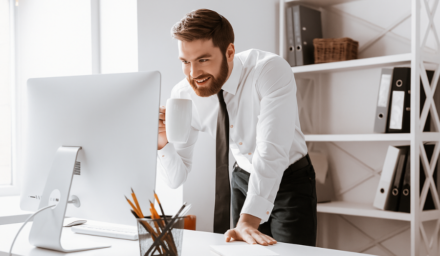 Financial adviser looking at screen in his office to check for secure email replies