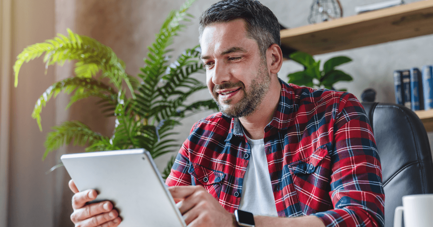 Man looking through outlook add-ins on a tablet