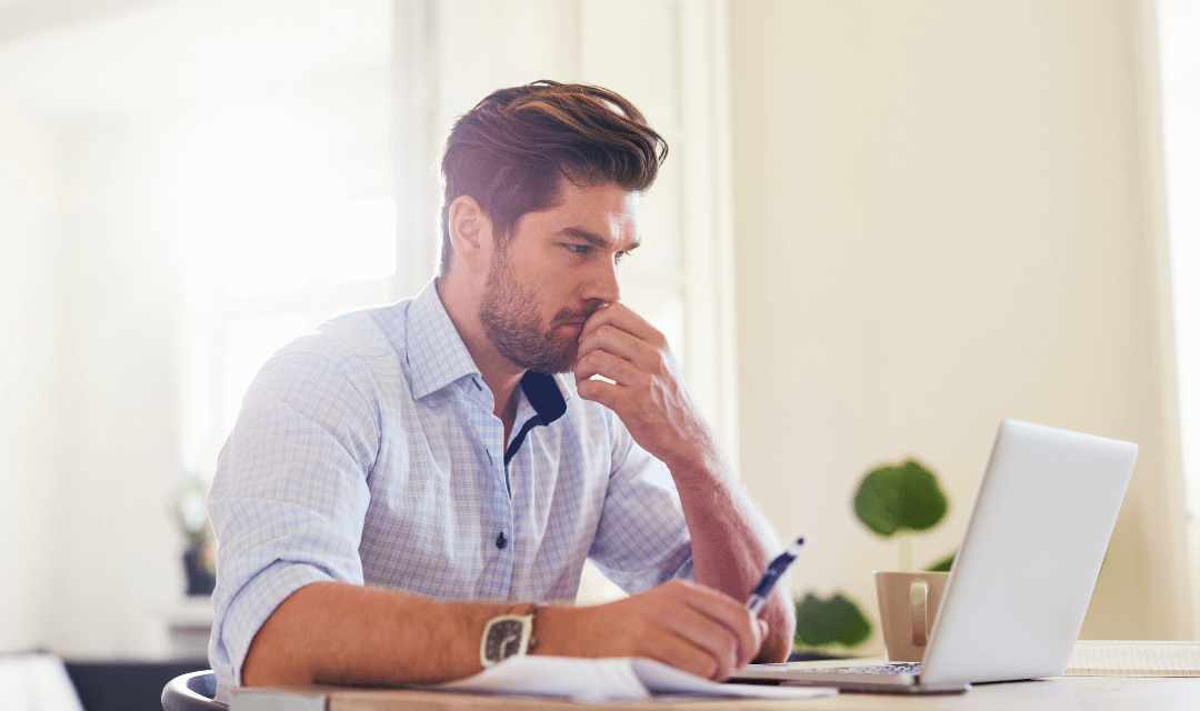 Professional reviewing financial details for annual returns, representing secure preparation and sharing of sensitive information with Mailock