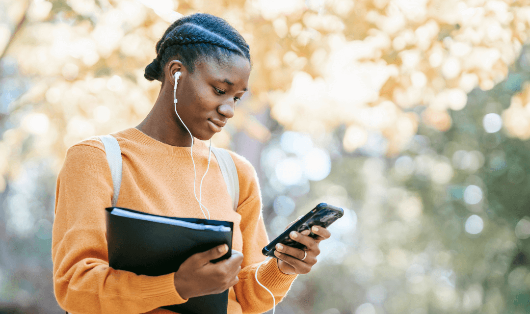 Individual receiving annual returns information on a mobile device, representing secure delivery of sensitive financial documents with Mailock