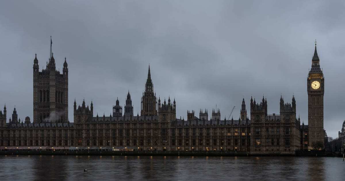 The Palace of Westminster and Big Ben seen across the River Thames at dusk