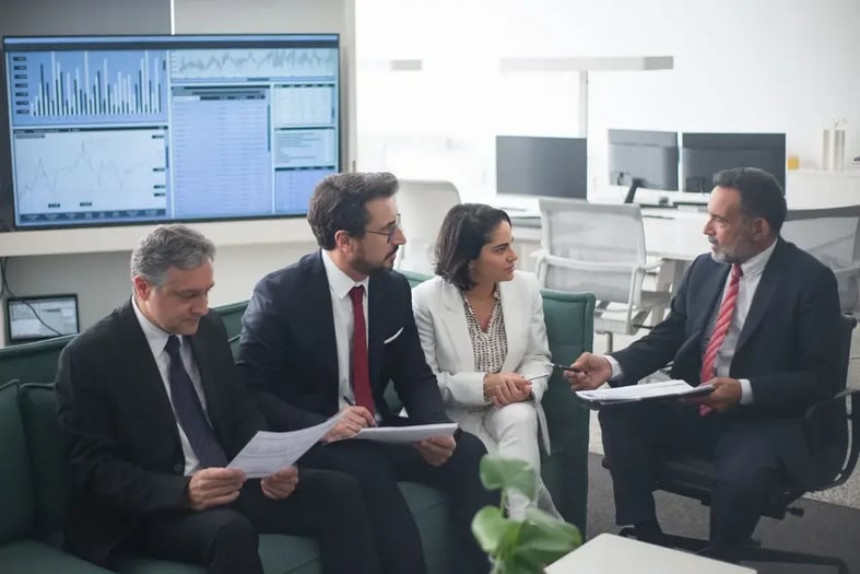 A financial services team meeting in an office