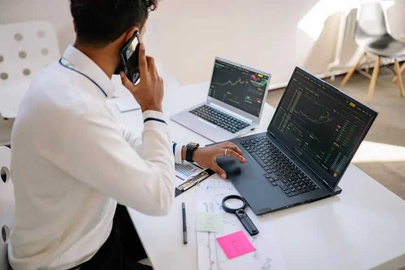 A professional reviewing options on a laptop