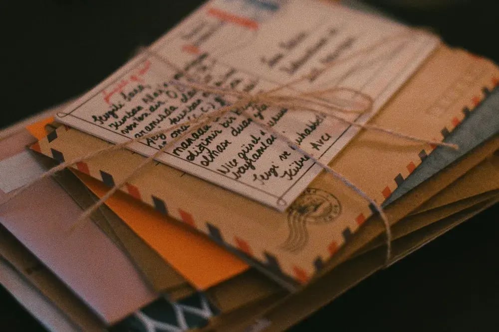 A bundle of posted letters tied with string
