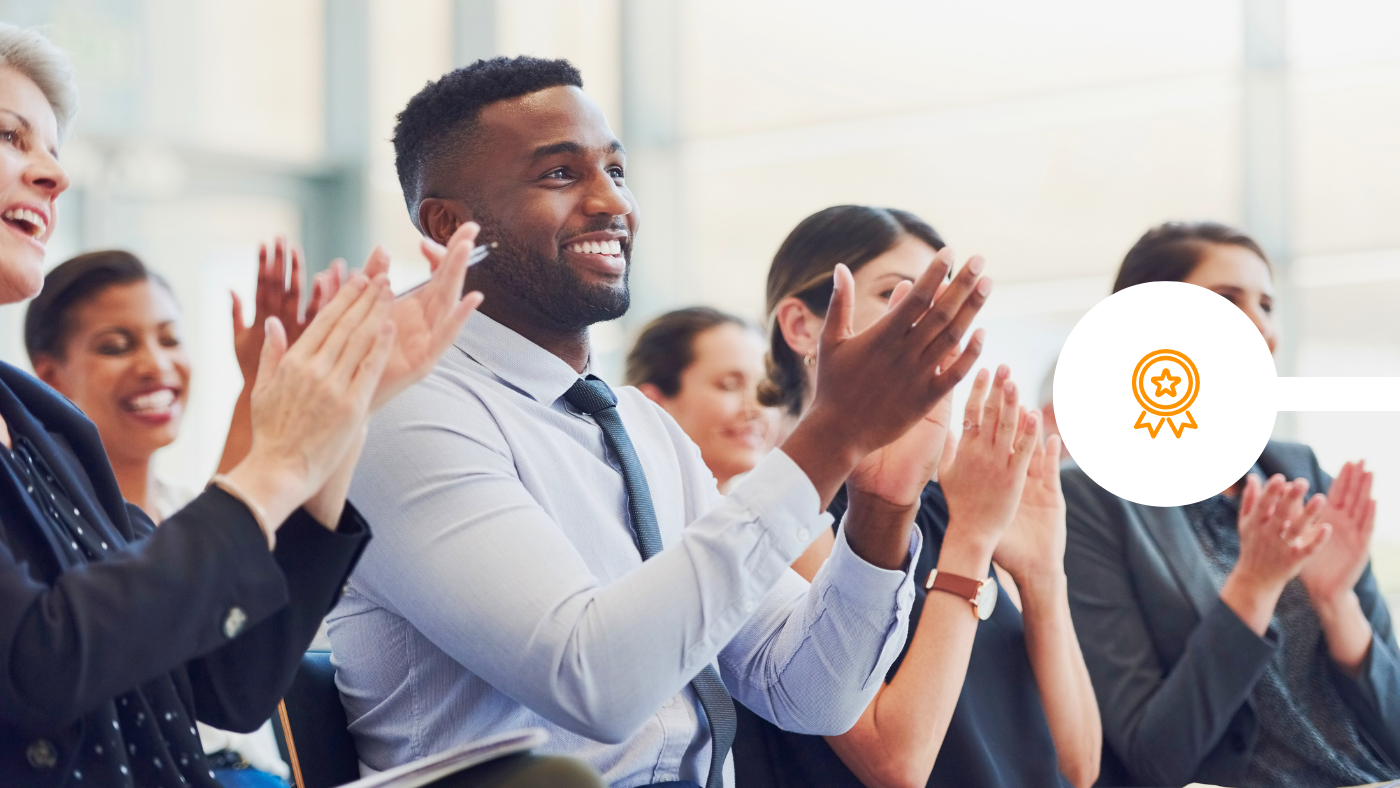 colleagues clapping at award win