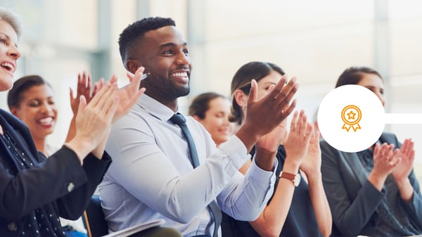 colleagues clapping at award win