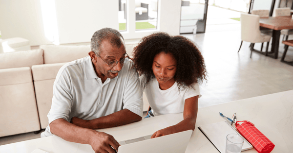 Couple using laptop at home to check email securely