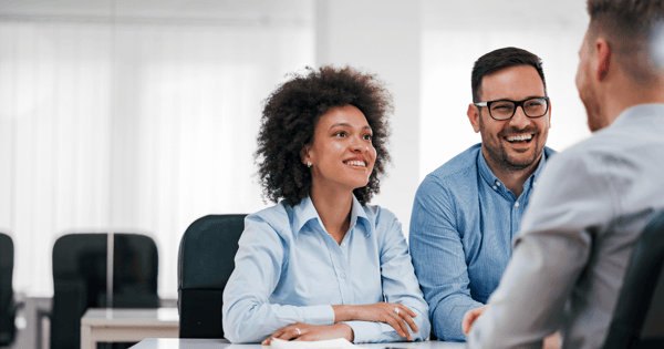 Financial adviser speaking with couple