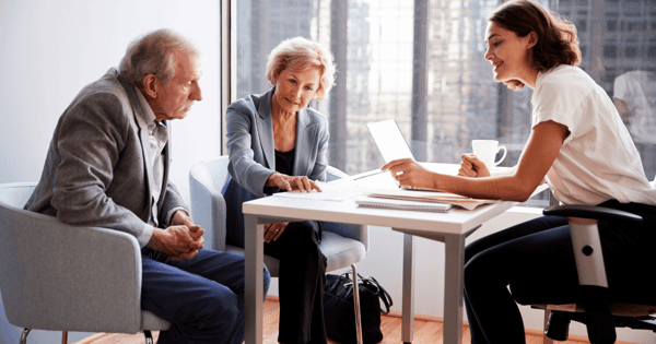Financial adviser speaking with clients