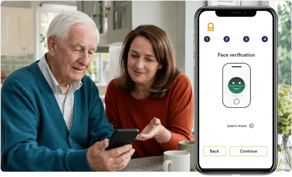 Older man and a woman looking at a smartphone beside the Mailock face verification step of an identity check