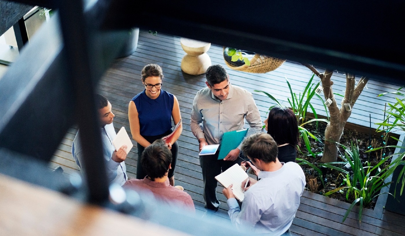 Marketing team in meeting discussing reputational benefits of secure email