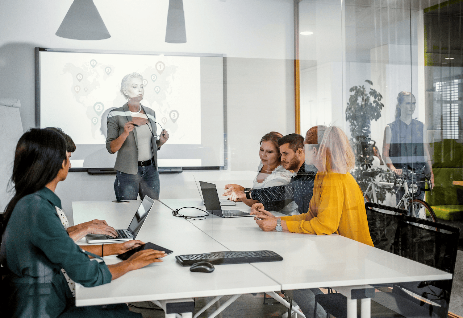 People in office discussing compliance solutions and secure email